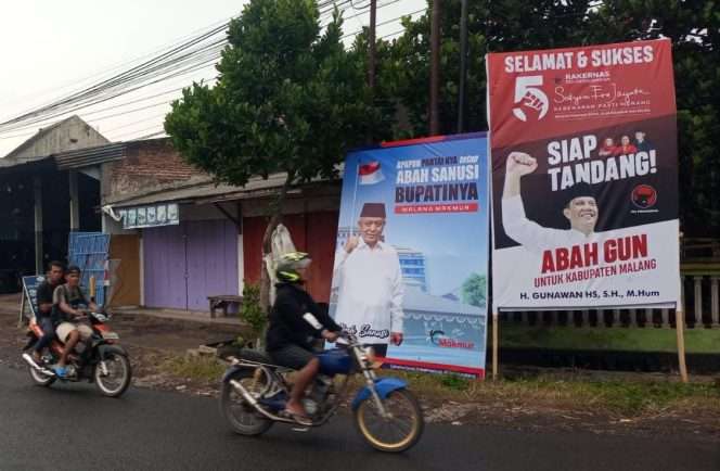 
 Baliho HM Sanusi dan H Gunawan Wibisono HS terpampang berdempetan di salah satu sudut jalanan Kabupaten Malang. (ist)