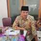 Anggota DPRD Kota Batu dari Partai Golkar, Drs. Didik Machmud, M.M saat tengah diwawancarai awak media. (Yan)