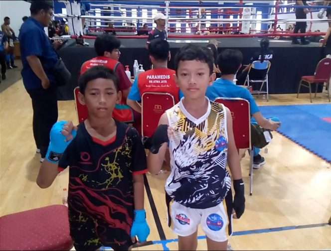 
 M. Syamil Baihaqi (kiri) usai memenangkan pertandingan. (ist)
